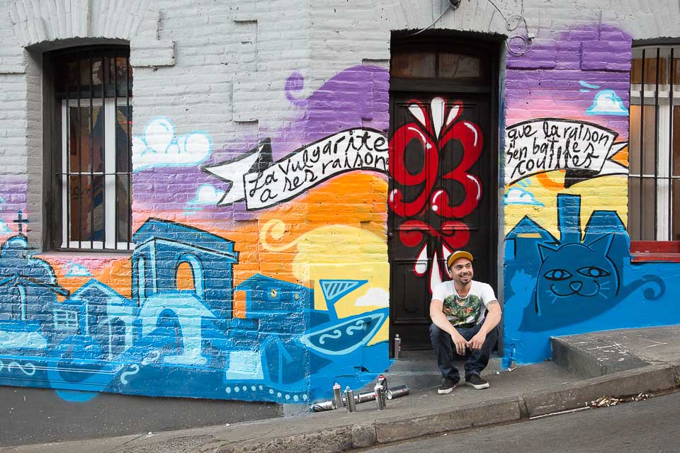 artist working on commissioned street art in Valparaíso, Chile